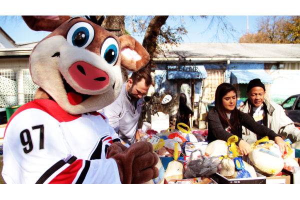 Carolina Hurricanes mascot and volunteers collecting turkeys for the community